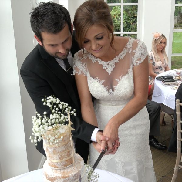 Wedding videographer North East - Jennifer and Dean's wedding in Northumberland in 2015 - Cutting the cake.