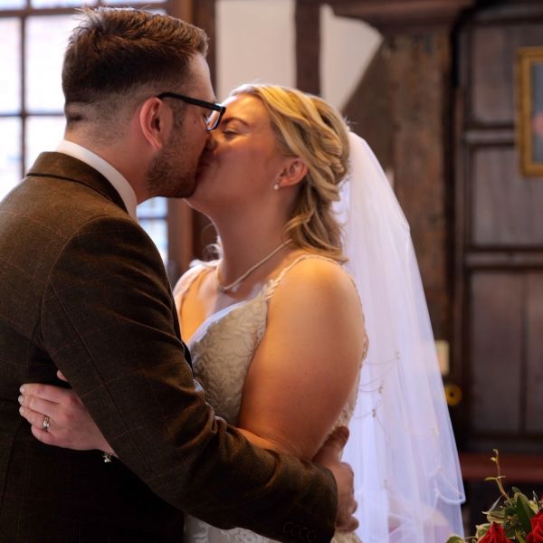 Hannah and Simon at The Merchant Adventurer's Hall - The ceremony over its 'kiss the bride' time